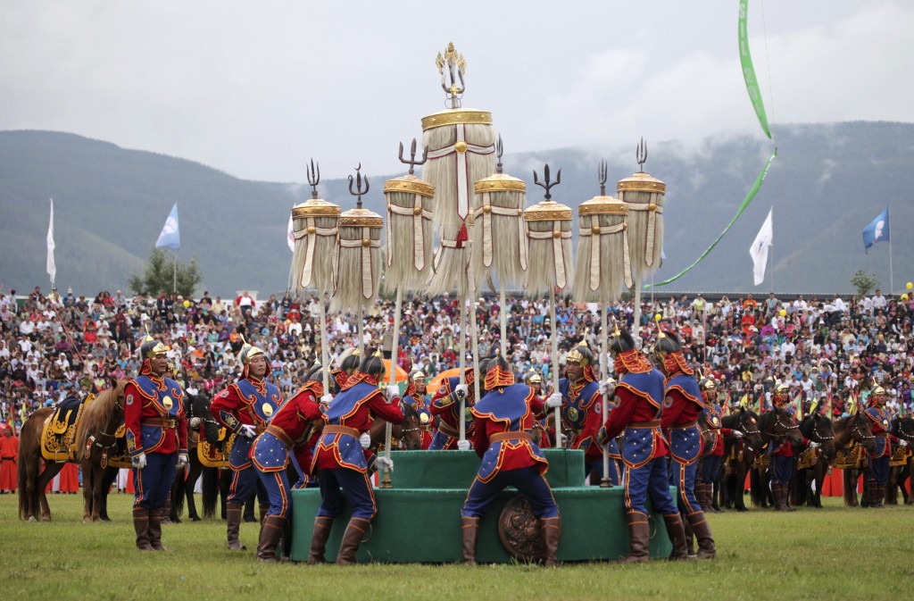 Mongolians place the Nine Flags during the annual Naadam Festival in Ulan Bator